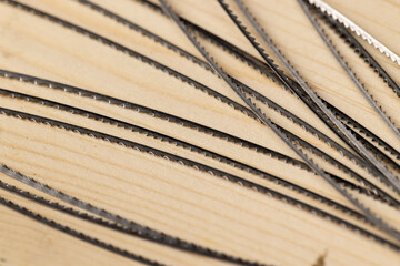 multiple metal brittle woodworking blades, selective focus close up