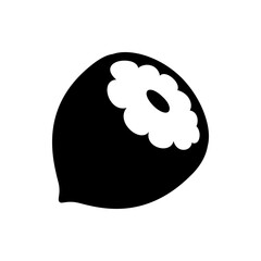Illustration of a black nut with a white flower shaped design and a dark oval in the center of it
