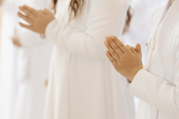 Child Praying with Folded Hands During First Holy Communion Ceremony