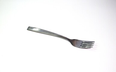 Stainless steel fork isolated on white background, simple cutlery design for kitchen, dining, and restaurant use.