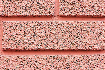 Pink textured brick wall background