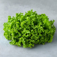 Obraz premium Fresh lettuce leaves on gray background, food photography, healthy eating