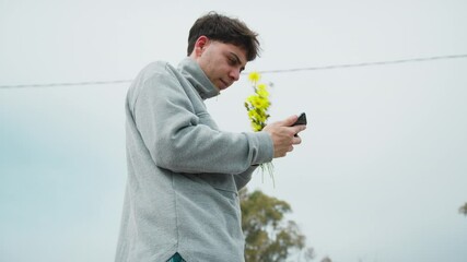 Man Doing A Picture Of The Flowers He Picked For Valentines Day 