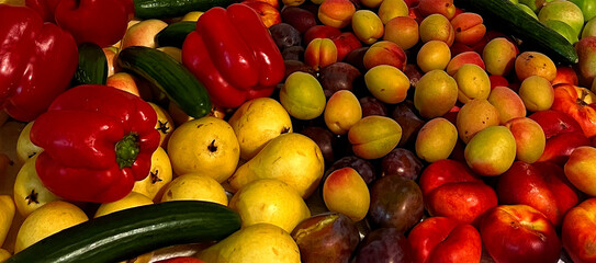 A background of various summer fruits including nectarine, apricot, plum, pear, apple, cucumber, and red bell pepper