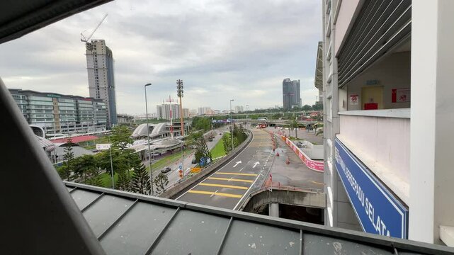 a view in front of Terminal Bersepadu Selatan or TBS bus station in KL. road and buildings view from TBS bridge. major transportation hub intercity bus