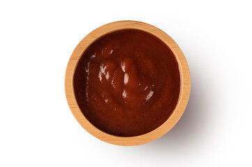 Tasty barbecue sauce in wooden bowl isolated on white background. Top view