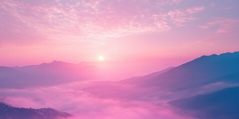 Obraz premium Sunrise over misty mountains with pink and purple sky, soft clouds and tranquil atmosphere. Dreamy landscape scenery outdoors.