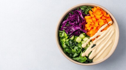 A colorful salad bowl with chopped vegetables and a creamy dressing, arranged neatly on a light background.
