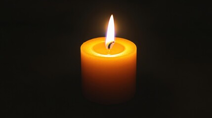 Single Lit Candle in the Dark