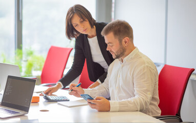 Fototapeta premium two colleagues of the partners are working in the office