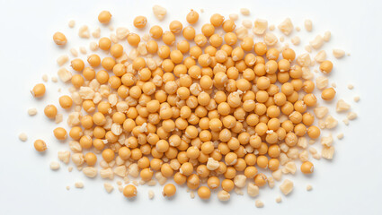 Close-up of yellow mustard seeds and flakes arranged on a white surface, highlighting their texture and natural colors.