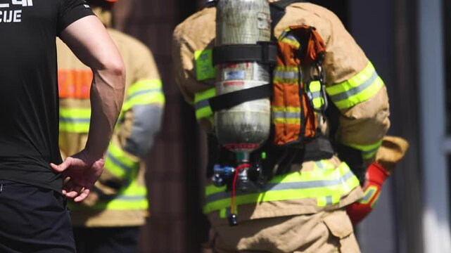 Group of South Korean fire men during fire fighting operation in the streets, firefighters with fire engine truck vehicle, 911 emergency and rescue, fire drill, exercise training, Busan, South Korea