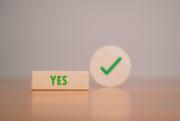 Wooden blocks show right and wrong signs, ideas, decisions, votes and yes or no. Business options...