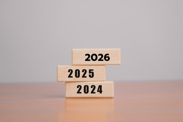 The 2026 concept wooden calendar represents business growth, leadership and strategic planning. It...