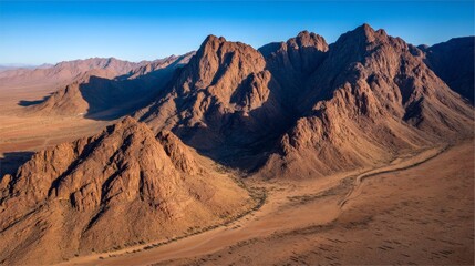 Stunning Aerial View of Rugged Desert Mountains in Brilliant Light