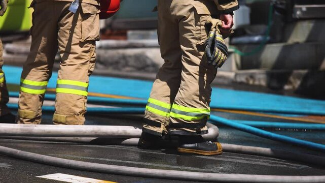 Group of South Korean fire men during fire fighting operation in the streets, firefighters with fire engine truck vehicle, 911 emergency and rescue, fire drill, exercise training, Busan, South Korea
