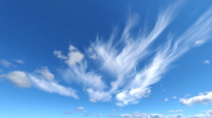 wispy clouds in a bright blue sky showcasing nature's artistry