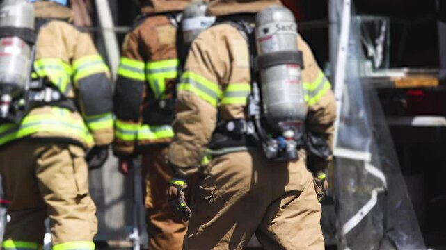 Group of South Korean fire men during fire fighting operation in the streets, firefighters with fire engine truck vehicle, 911 emergency and rescue, fire drill, exercise training, Busan, South Korea