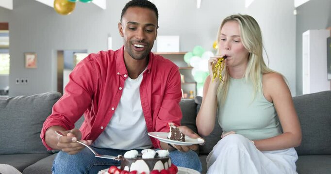 Happy black man and his white female partner talking, eating, celebrating thirtieth birthday at home