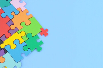 colorful puzzle piece with a red plus sign on it