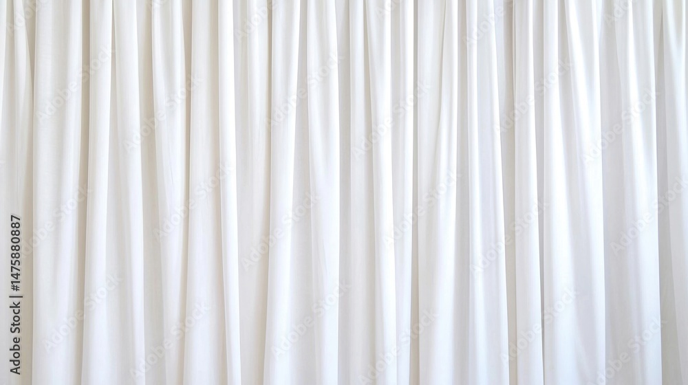 Poster white fabric curtains hanging in soft, vertical folds, creating a clean and minimalistic backdrop.
