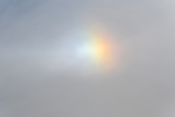 Rainbow flare light phenomenon in the daytime sky
