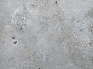 Worn Cement Surface with Natural Marks and Rough Texture. Rough concrete texture with natural weathering, stains, and scratch marks. Ideal for backgrounds or grunge-themed designs