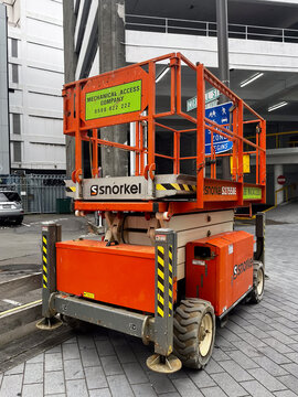 Mobile Scissor Lift by Snorkel Parked in Urban Work Zone