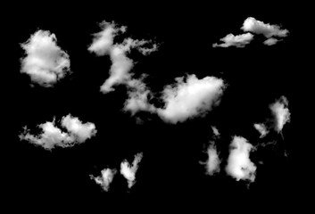 Beautiful white clouds isolated on a black background or black and white haze. In natural summer sky weather gorgeous environment.	