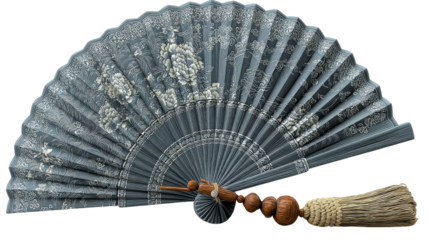 Hand Fan with Ornate Design: A delicate hand fan with a gray and silver floral motif, intricately detailed and finished with a tassel, embodies classic elegance and a touch of the Orient.  