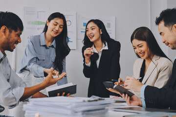 Team of financial advisory services. Asian advisor showing plan of investment to clients in the consultancy office..
