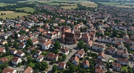 Obraz premium Aerial View of Town with Church and Residential Buildings