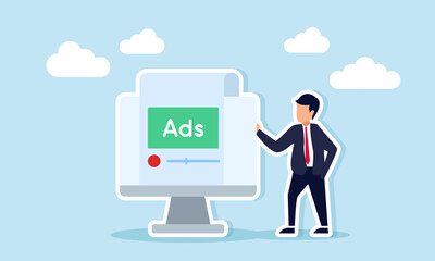 Businessman Standing Beside Monitor Displaying ADS Interface Representing Monitoring Business Advertising Performance