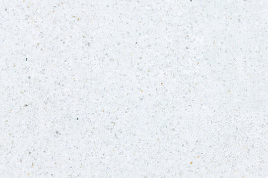 Seamless texture of terrazzo surface. Small gravel mixed with concrete. Grinding to smooth. White bright shiny reflection surface for decoration interior exterior on floor wall suit for background.