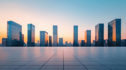 Empty plaza with tiled floor overlooking modern cityscape with glass skyscrapers at sunset, ideal for corporate branding visuals