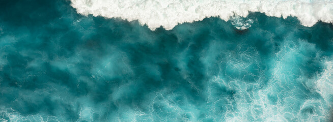 Banner Turquoise ocean sea water white wave pattern splashing deep blue sea. Banner Tropical sea beach Seascape dark background wave splash on rock. Summer Ocean Surface big wave with copy space © aFotostock