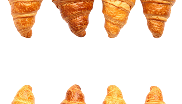 Freshly baked pastries and assorted baked breads on white background

