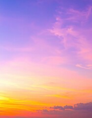 Fototapeta premium A breathtaking sunset paints the sky in vibrant hues of orange, pink, and purple, as fluffy clouds drift lazily, reflecting the warm colors.