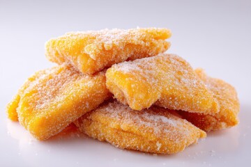 Detailed view of frozen breaded fish on a white surface ready to cook