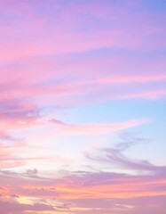 Fototapeta premium A breathtaking sunset paints the sky in vibrant shades of pink, with soft clouds reflecting the warm hues, creating a serene and dreamy atmosphere.
