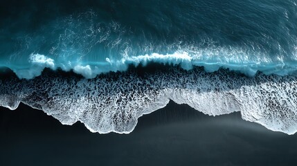 Beach coastline with foamy waves on dark sand