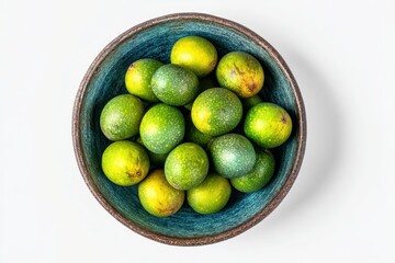 Overhead shot of tropical matoa in a ceramic bowl on white highlighting its freshness and distinct look ideal for grocery promotions