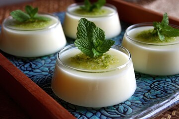 Smooth sweet lychee dessert garnished with mint