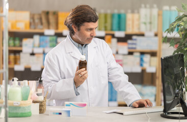 Male pharmacist offers to buy cough syrup at the pharmacy