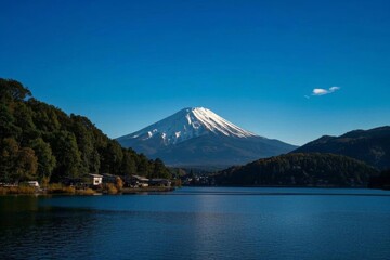 arafed mountain in the distance with a lake in the foreground