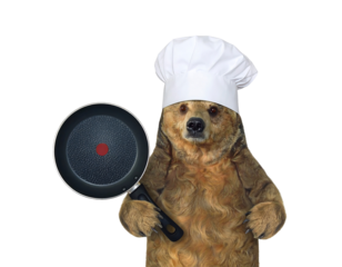 Brown Bear Chef in a White Toque Holding a Frying Pan