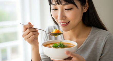 Woman Eats Soup