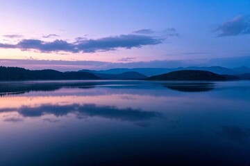 Fototapeta premium arafed view of a lake with a mountain in the distance