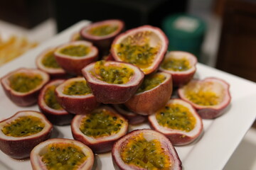 sliced passion fruit and dragon fruit on a plate