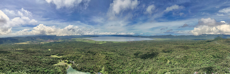 Obraz premium Aerial Panoramic View of Lake Mainit and Surrounding Tropical Forests,Surigao del Norte,Philippines